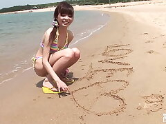 Skinny Asian Beauty Poses on the Shore